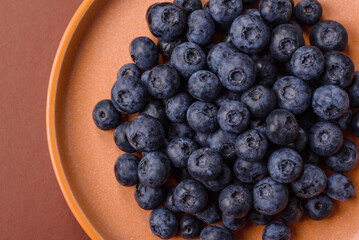Fresh juicy blueberries, healthy vegan food with vitamins and minerals. Blueberries berry