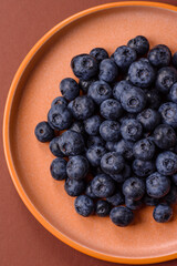 Fresh juicy blueberries, healthy vegan food with vitamins and minerals. Blueberries berry