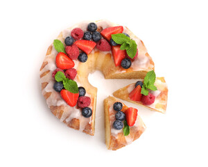 Pieces of delicious bundt cake with berries, glaze and mint isolated on white, top view
