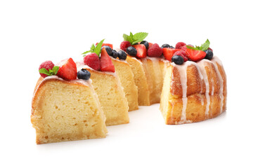 Pieces of delicious bundt cake with berries, glaze and mint isolated on white