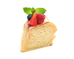 Piece of delicious bundt cake with berries, glaze and mint isolated on white