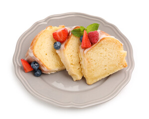 Pieces of delicious bundt cake with berries, glaze and mint isolated on white