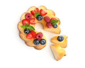 Tasty Bundt cake with berries and mint isolated on white, top view