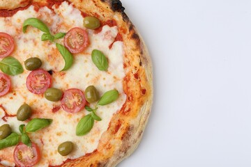 Delicious pizza with tomatoes, olives and basil on white table, top view. Space for text