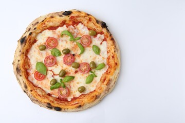 Delicious pizza with tomatoes, olives and basil on white table, top view. Space for text