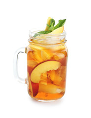 Refreshing iced peach tea with mint in mason jar isolated on white