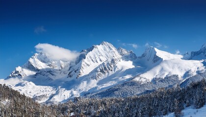 towering snowy mountains under bright blue sky in winter landscape