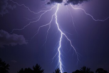 A powerful bolt of lightning strikes through a dark, cloudy sky at night, illuminating the scene in a striking display of natures raw energy