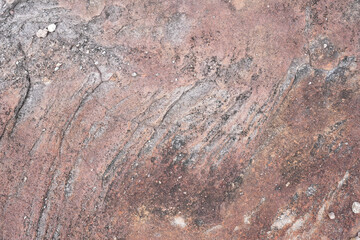 Ancient red weathered rock wall terrain with stain texture