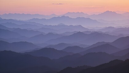 Fototapeta premium Distant Ridge Silhouette at Sunset: Layers of Blue and Purple Mountains