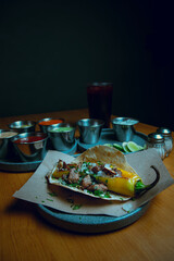 Mexican food. Steak tacos in a restaurant with dramatic lighting and retro or vintage inspiration.