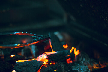 Close-up detail of a piece of coal burning red-hot.