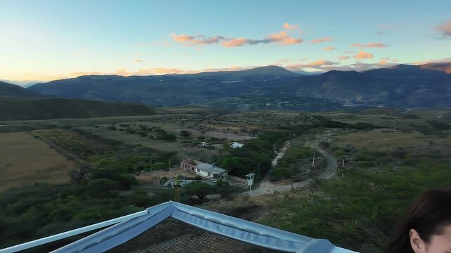Sunset landscape of Ibarra, Ecuador, surrounded by mountains and arid vegetation in summer.
