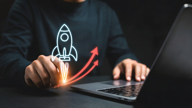 Man using laptop with rocket and arrows graphic symbolizing business growth and development shown digitally