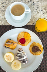 Fruit and vegetable breakfast with coffee on the table. Top view