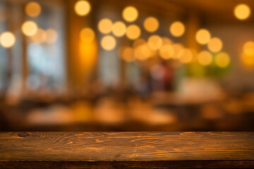 Empty wooden table  bokeh light background. Tables and chairs in the lobby of restaurant. Visitors to restaurant for dinner. Cozy bokeh lightening. Beautiful bright interior. Blurred bokeh basic