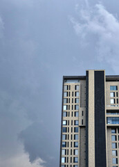 Modern building with cloudy sky background