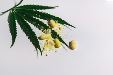 large medical cannabis with yellow stitch and medicine on a light background