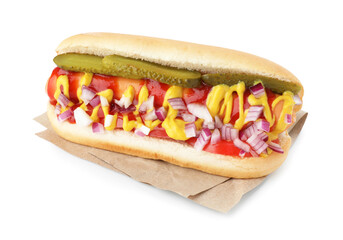 Tasty hot dog with pickles, onion, ketchup and mustard isolated on white