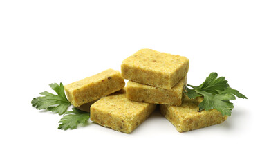 Aromatic bouillon cubes and parsley isolated on white
