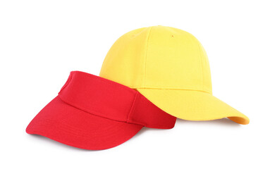 Yellow baseball and red visor caps isolated on white. Mockup for design