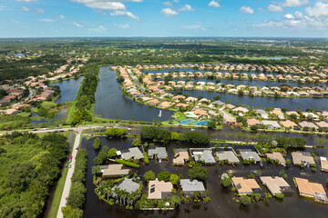 Flooding in Florida caused by tropical storm from hurricane rainfall. Suburb houses in residential...