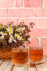 Medicinal herbal tea or infusion with wild herbs, the concept of alternative folk medicine, advertising of a green pharmacy, a collection of useful herbs for treatment according to folk recipes