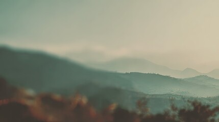 Obraz premium Misty Mountain Range Landscape at Sunrise