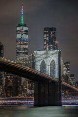 Night view with scenic close-up Brooklyn Bridge and One World, Trade Center