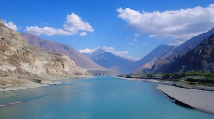 Scenic view of the Indus River, a historic waterway flowing through Pakistan and India, featuring calm waters, fertile riverbanks, traditional boats, rural villages, and lush vegetation