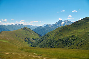 a beautiful view of the summer mountains, valleys, and waterfalls