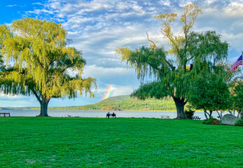 a couple watches a rainbow across the Hudson River
