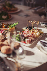 Catering spread featuring assorted delicacies and fresh vegetables at a gathering in a bright setting
