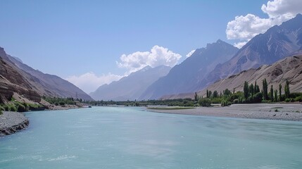 Scenic view of the Indus River, a historic waterway flowing through Pakistan and India, featuring calm waters, fertile riverbanks, traditional boats, rural villages, and lush vegetation