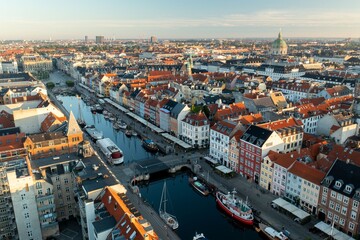 Cinematic Drone View of Nyhavn Canal and Copenhagen Rooftops