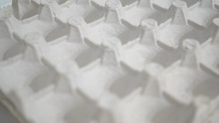 Empty egg carton made of recycled paper pulp, sustainable packaging background

