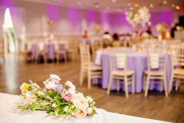 Elegant White and Purple Decorated Reception Venue with Floral Bouquet for Quinceañera or Wedding
