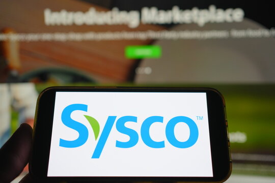 Roosendaal, The Netherlands - August 02, 2025: A mobile phone displaying the company logo of Sysco, with the company website in the background.