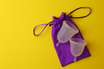 EcoFriendly Sustainable Menstrual Cups in a Pouch on a Bright Background
