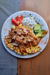 Delicious Greek chicken gyros with pita, fries, creamy tzatziki, cucumber, and tomato. Perfect for editorial or commercial use. Rethymno, Crete, Greece, July 25, 2025