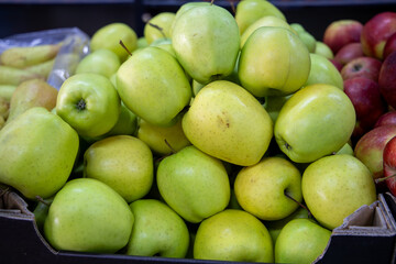 Many ripe red, green apples. Sale of apples at the market and store. Background. Top view. Concept sale at the market and store. Farm products.