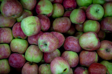 Many ripe red, green apples. Sale of apples at the market and store. Background. Top view. Concept sale at the market and store. Farm products.