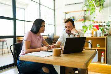 Freelancers working on a project in a coffee shop