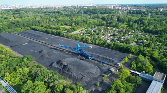 Spreader coal Excavator at a coal storage. Great aerial view flight drone