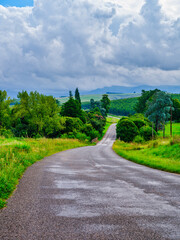 Vertical shot: Winding road descending into Drakensberg valley, South Africa