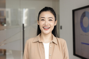 Successful business lady profile picture. Head shot portrait cheerful millennial businesswoman hr manager look at camera talk on videocall from office hold job interview speak on virtual conference
