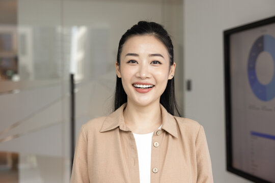 Successful business lady profile picture. Head shot portrait cheerful millennial businesswoman hr manager look at camera talk on videocall from office hold job interview speak on virtual conference