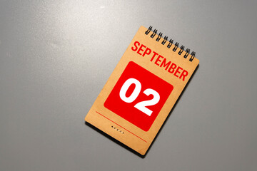 Wooden calendar with the date September 2. Monthly calendar