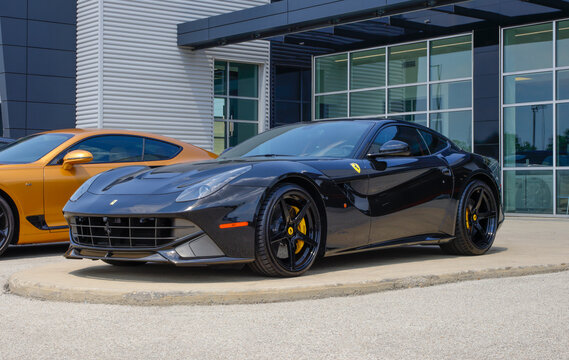 Ferrari F12 Berlinetta Coupe display at a dealership. Ferrari offered the F12 Berlinetta with a 730HP 6.3L V12 engine. MY:2014
