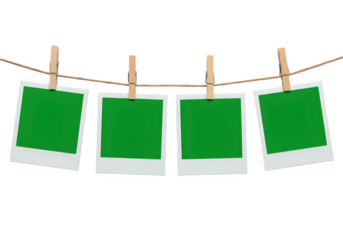 A row of four Chroma key Green format Polaroid frames pinned on a rope with clothespins, , isolated on white or transparent background. PNG